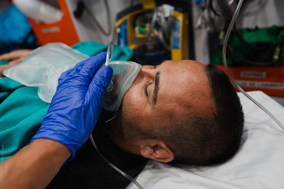 patient receiving oxygen from a mask