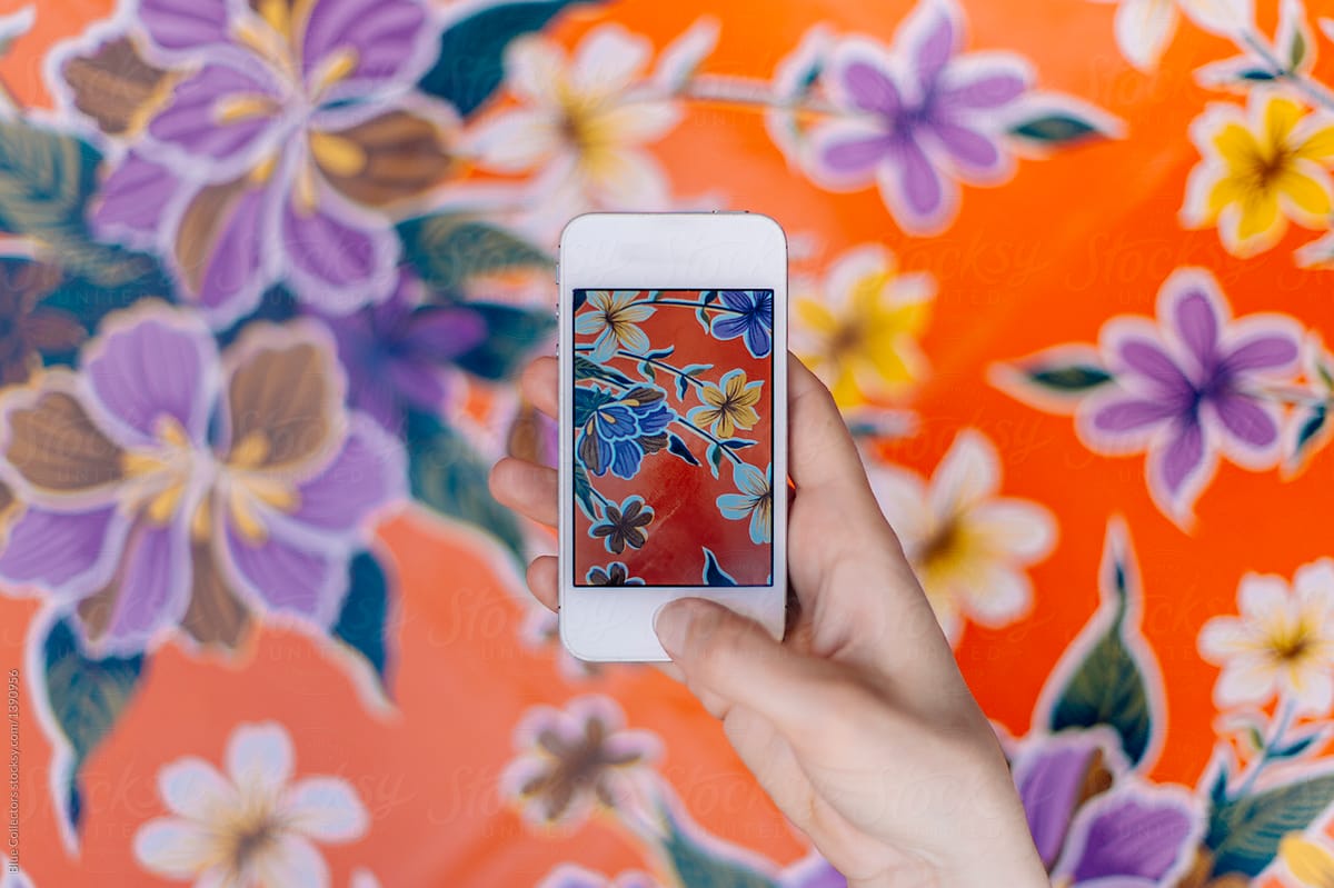 Photo of a flower blanket with a telephone