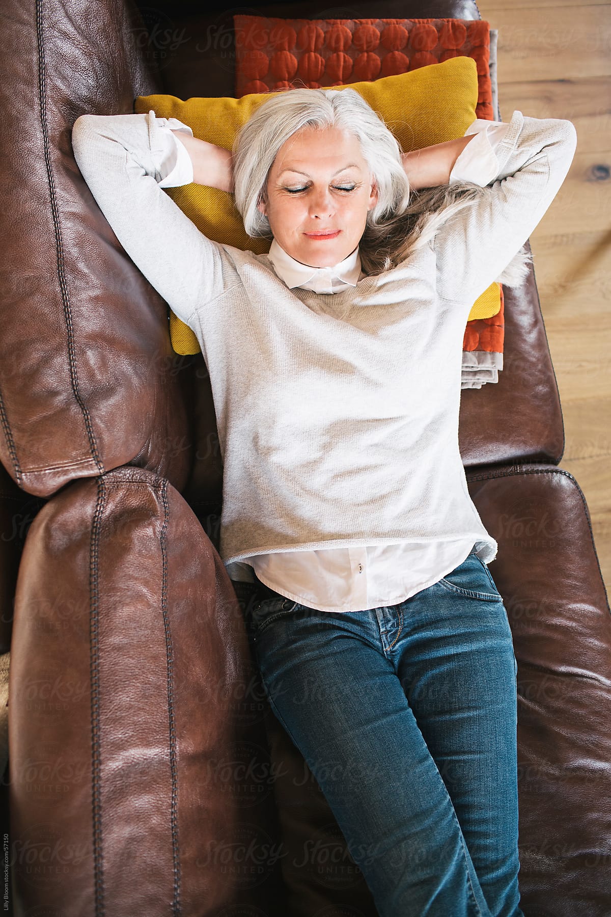 Senior woman resting on her sofa