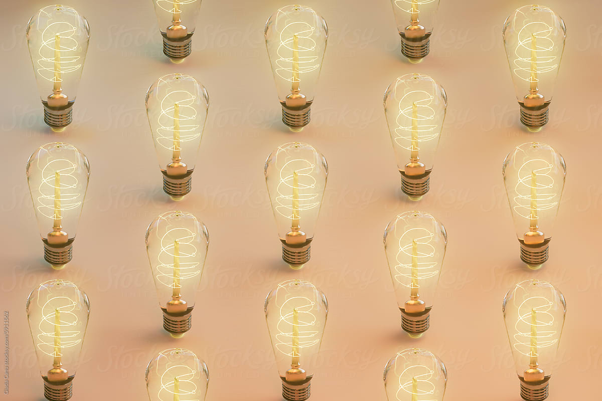 Matrix of Illuminated Edison Light Bulbs on Soft Gradient