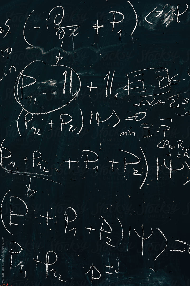 Maths formulas written by white chalk on the blackboard backgrou