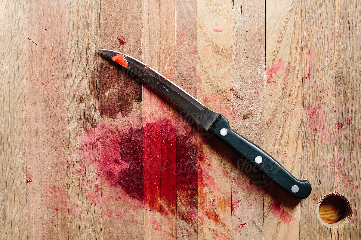 knife and stain on cutting board
