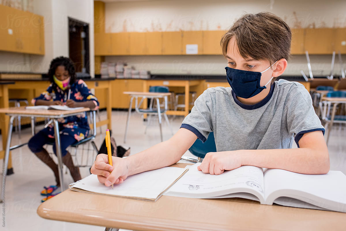Boy with mask in school during COVID-19