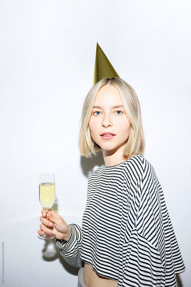 Direct Flash Portrait Of Blonde Woman With A Champagne Glass