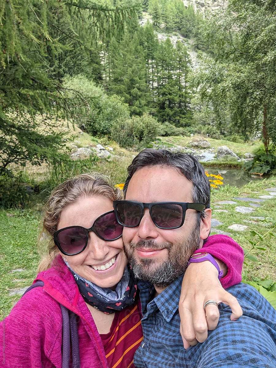Adult Couple Selfie in a Alpine Garden during Summer