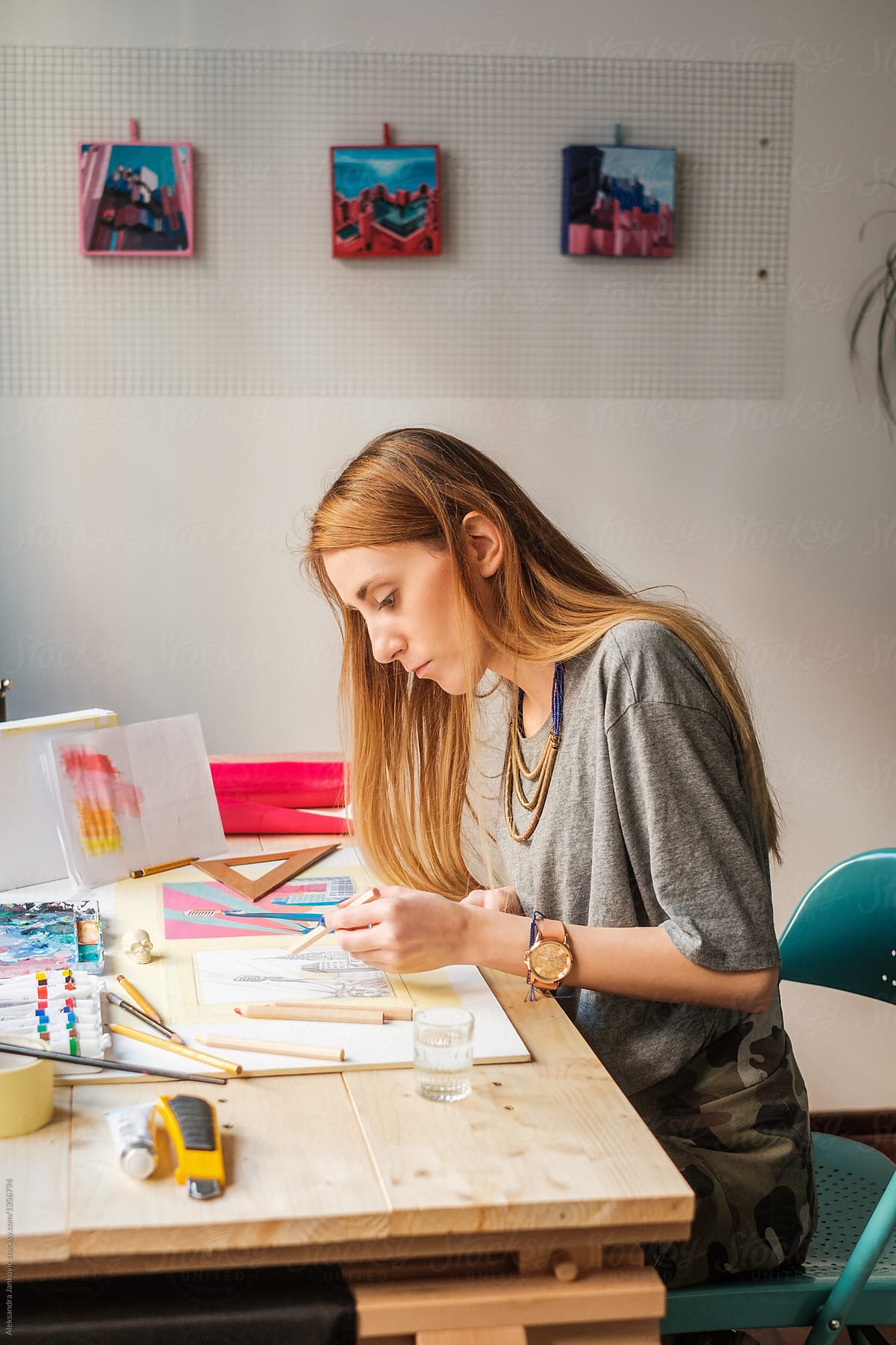 Young Female Graphic Designer Working At The Studio