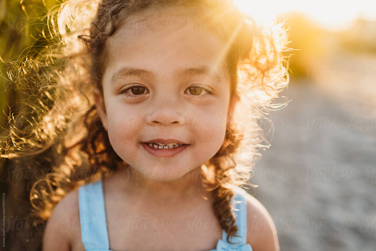 Rays of sunshine across young girl's face