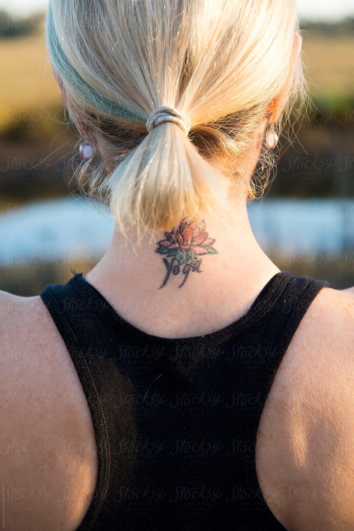 Crown tattoo on the back of the neck.