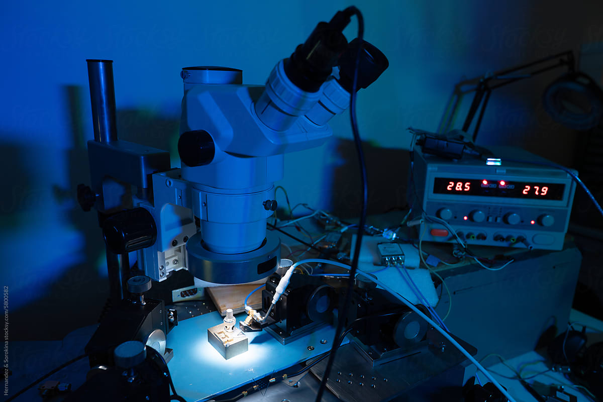 Microscope Surrounded By Scientific Devices