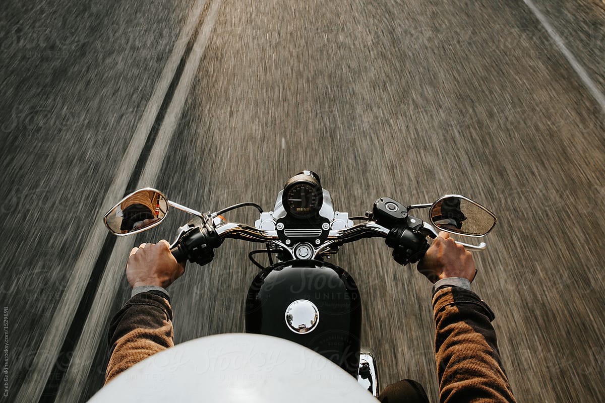 Motorcyclist holding handles