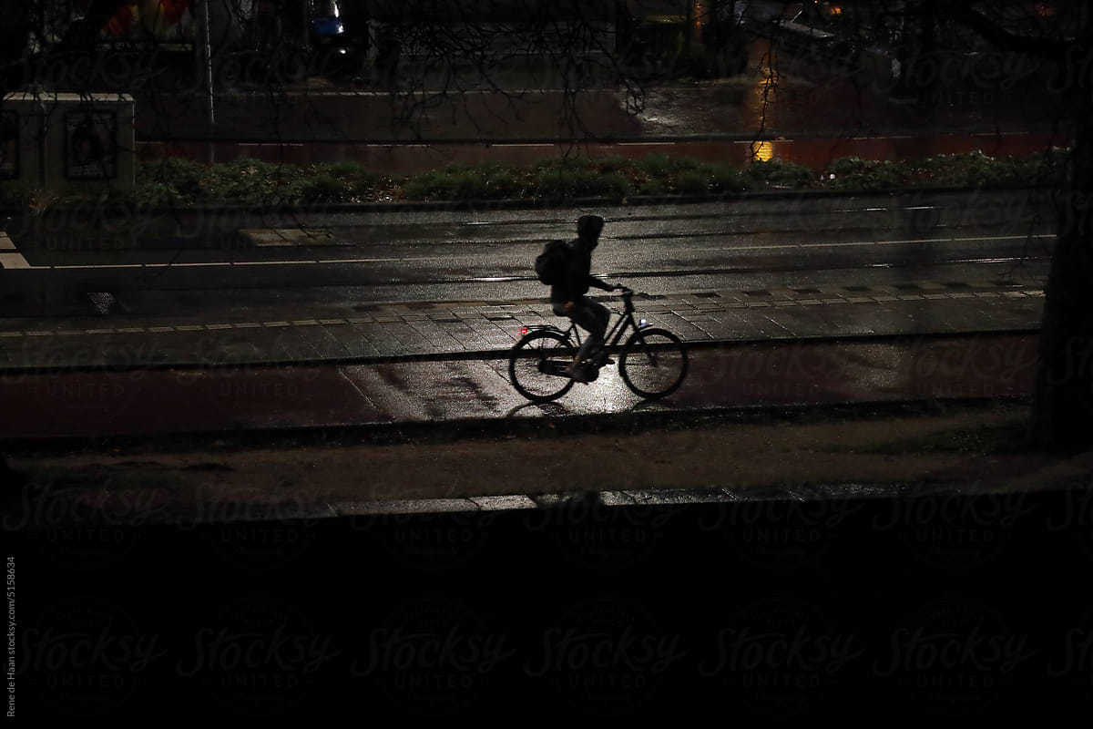 cyclist in the rain at night