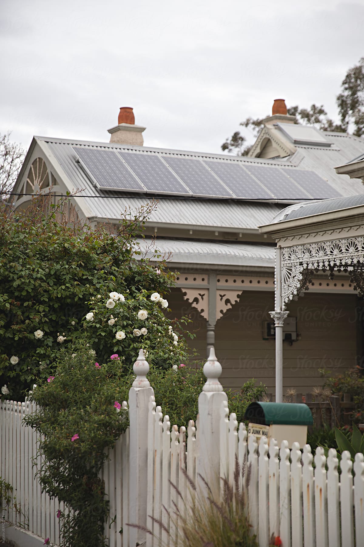 Inner-city Melbourne Australia homes with solar roof panels - renewable energy on a cloudy day