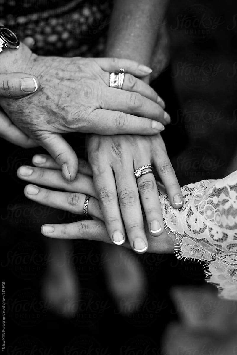 3 generations of women holding hands together