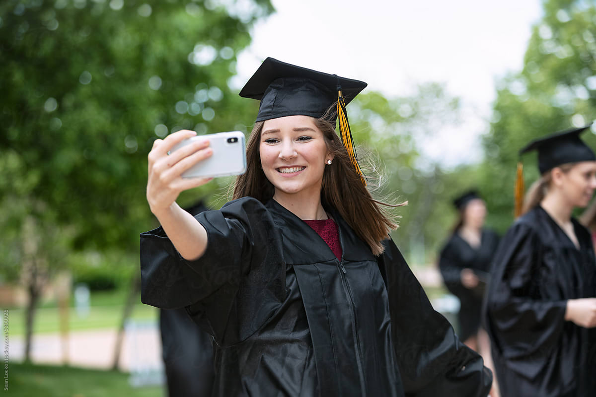 Grad: Excited Graduate Takes Selfie With Cell Phone