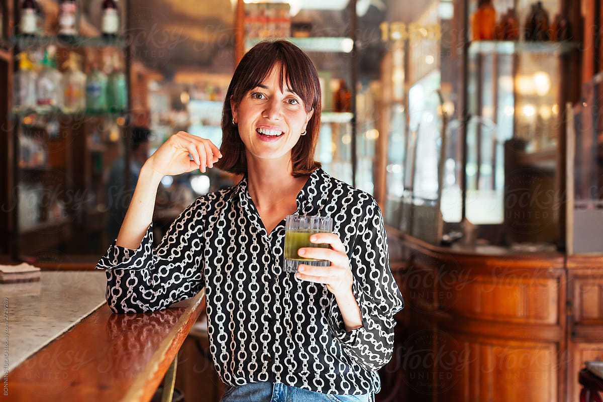 Adult woman relaxing in pub
