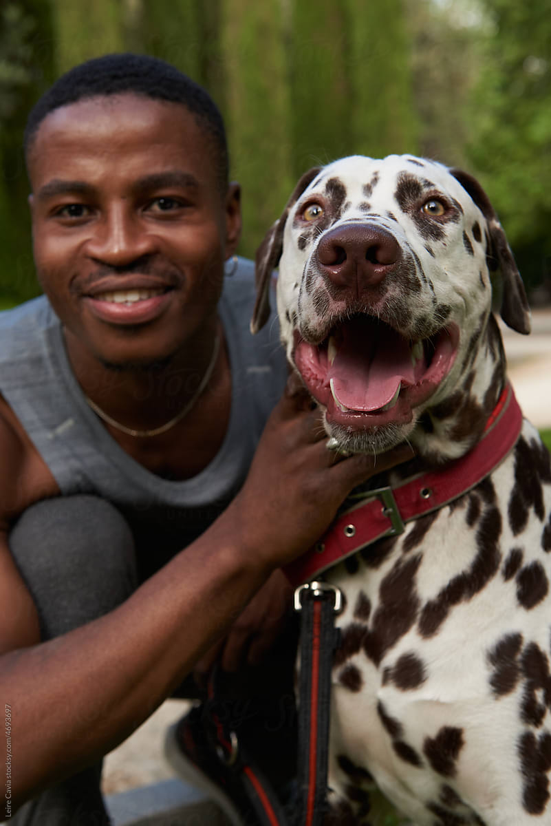 Close up of a happy doggy  and young men