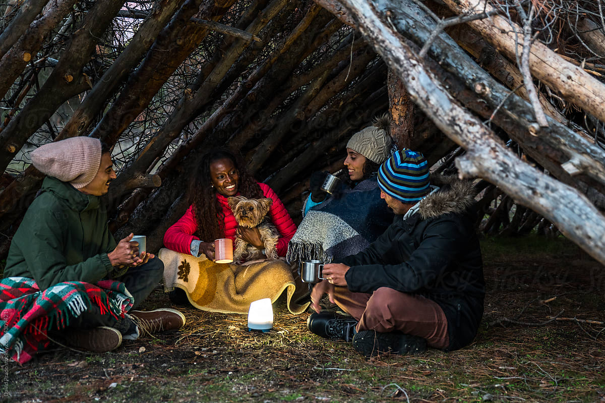 Friends drinking tea during camping
