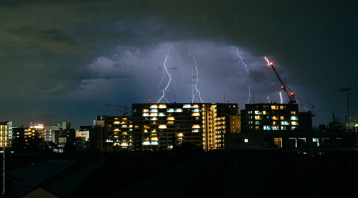 Lightning strikes at apartment building at night