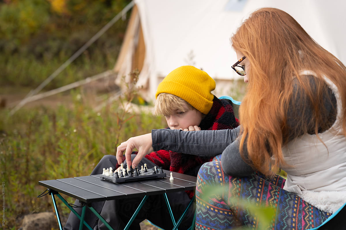 Mom Son Playing Chess Backcountry Camping