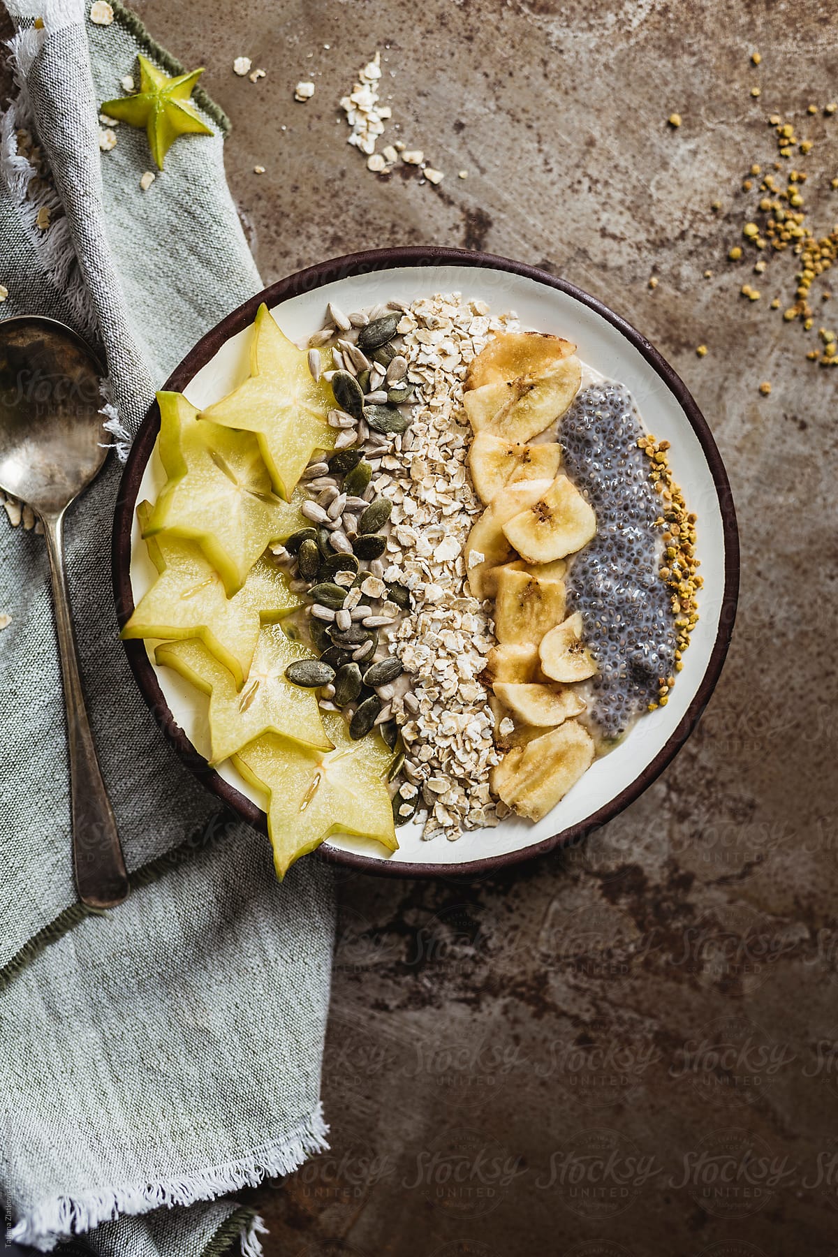 Muesli with carambola, seeds, dried banana and pollen