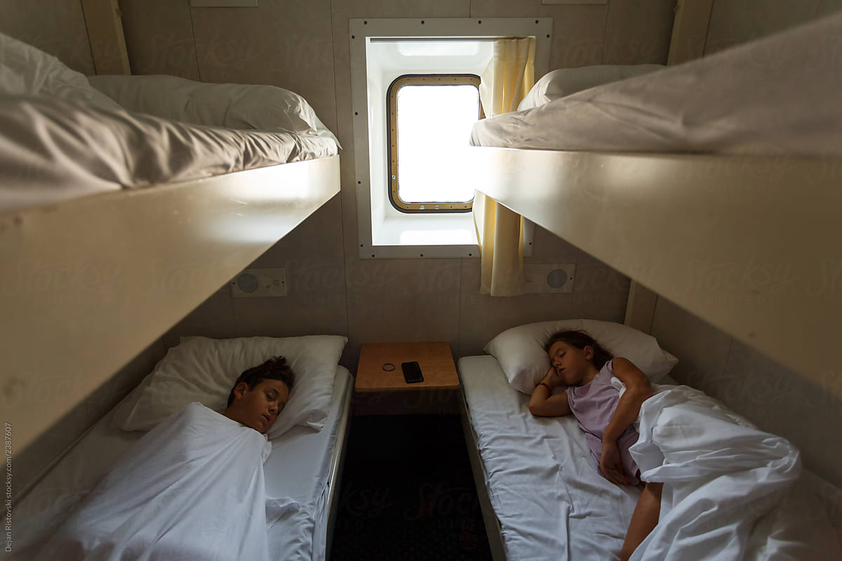 Children sleeping in a boat cabin