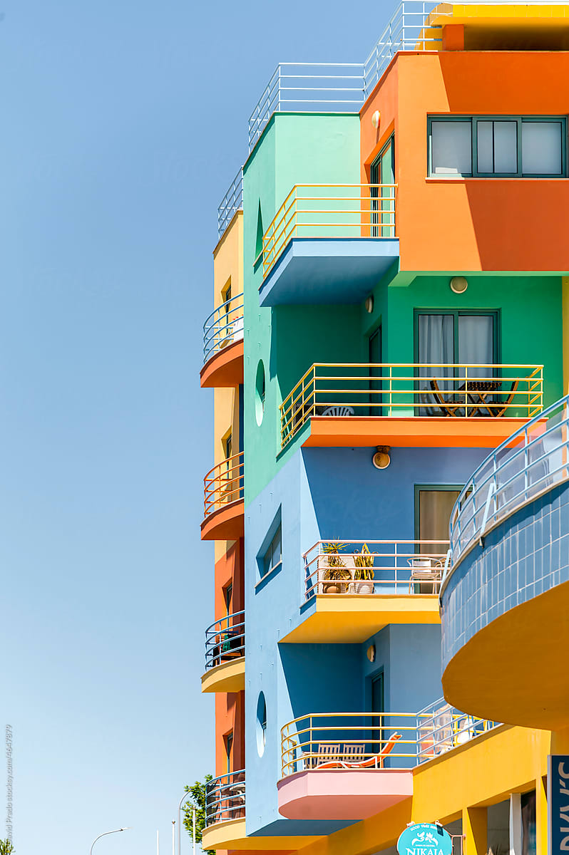 Colorful residential building under blue sky in Albufeira Harbor