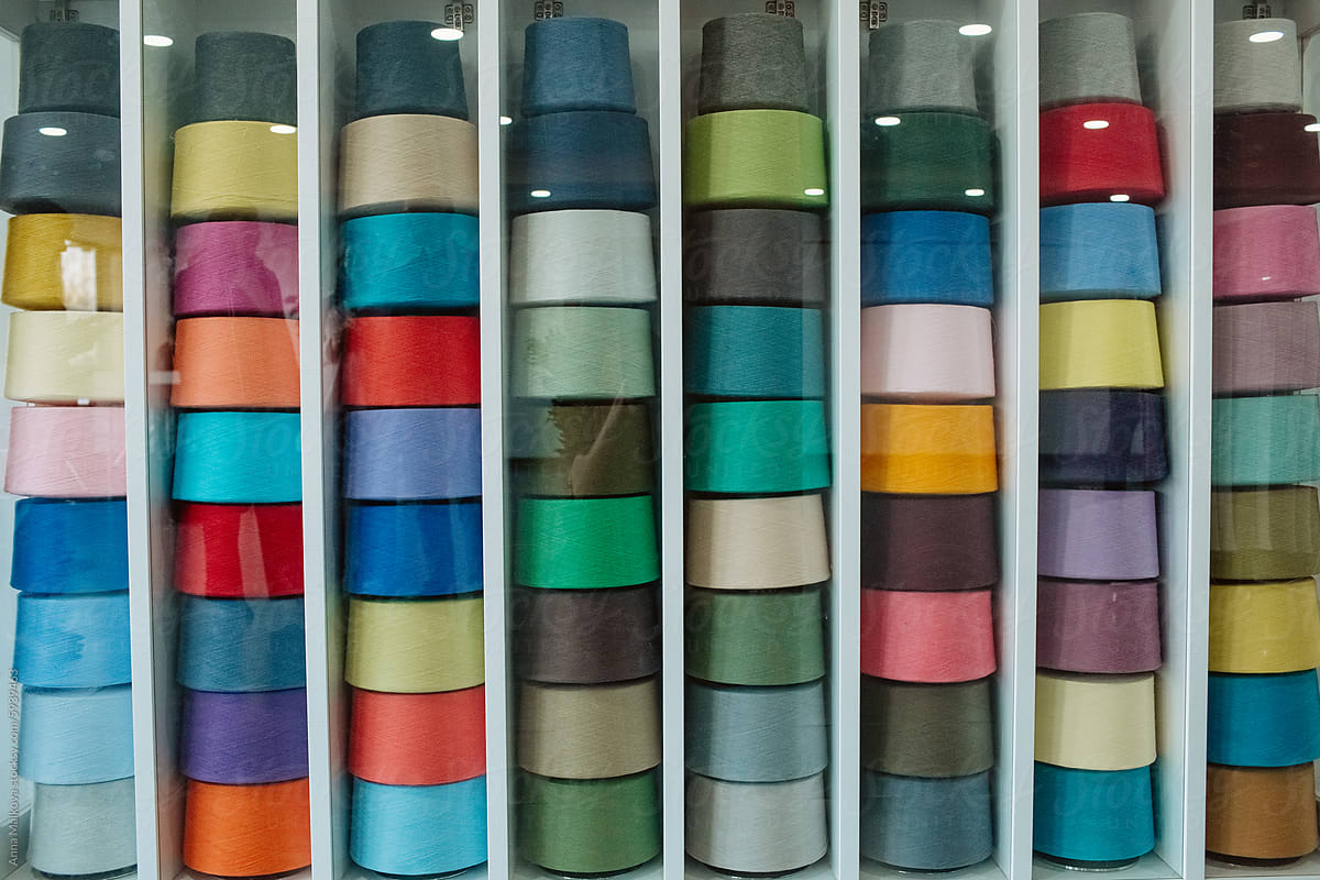 display case of colourful thread
