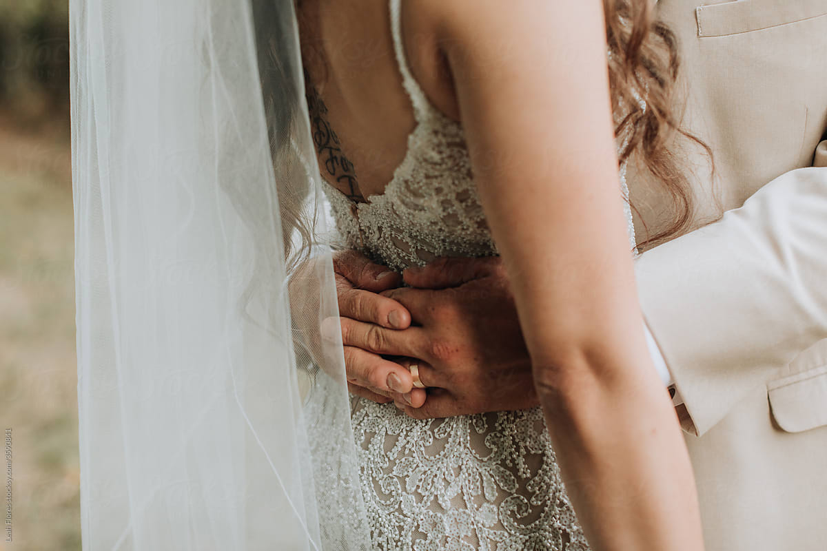 Closeup of Bride and Groom\'s Embrace