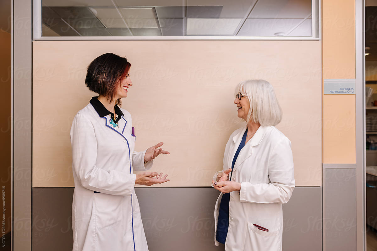 Two female medical professionals in conversation