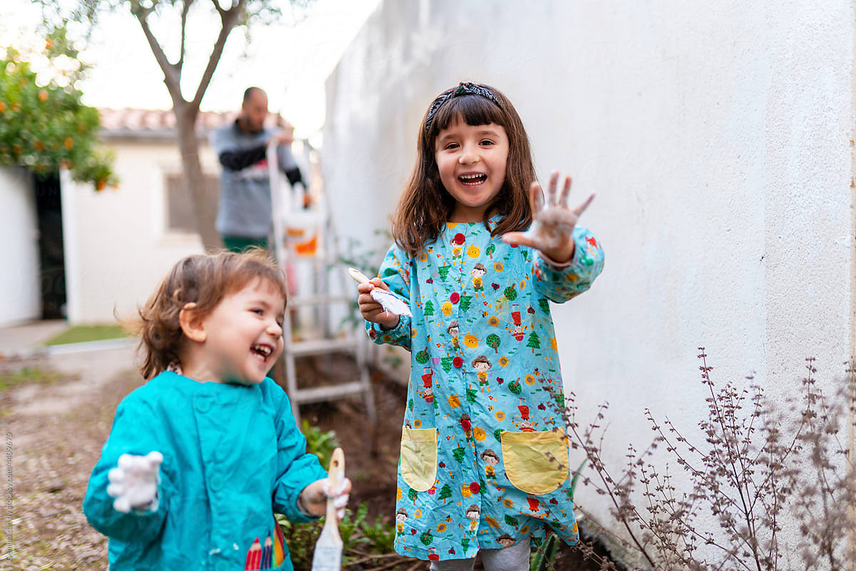 UGC - Happy sisters painting backyard