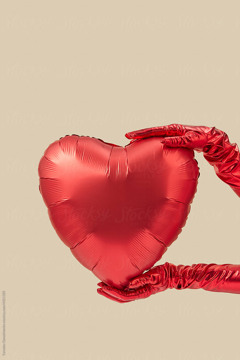 Woman holding heart balloon