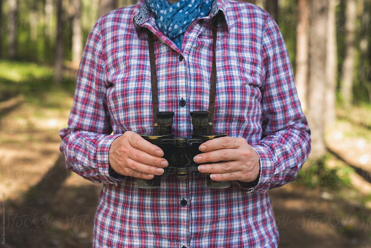 Woman with vintage binoculars