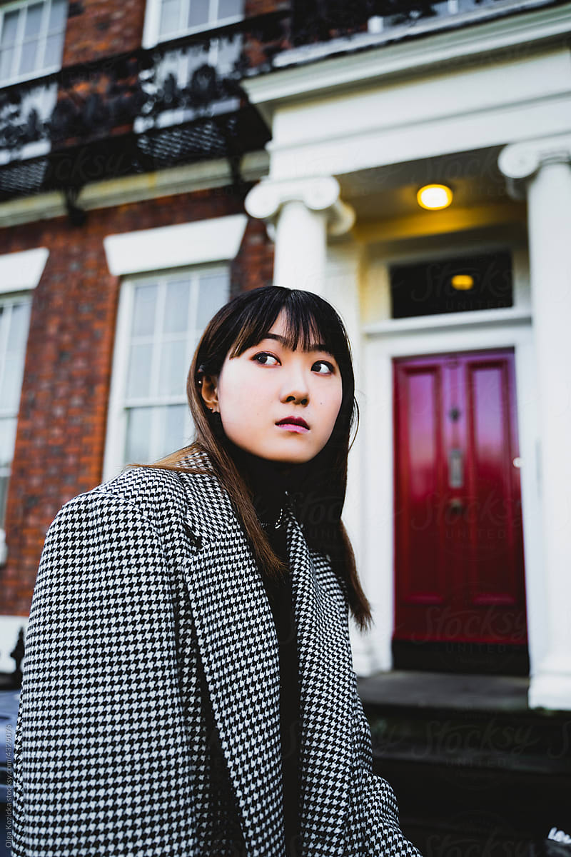 Asian Woman Walking Street By British Tenement House