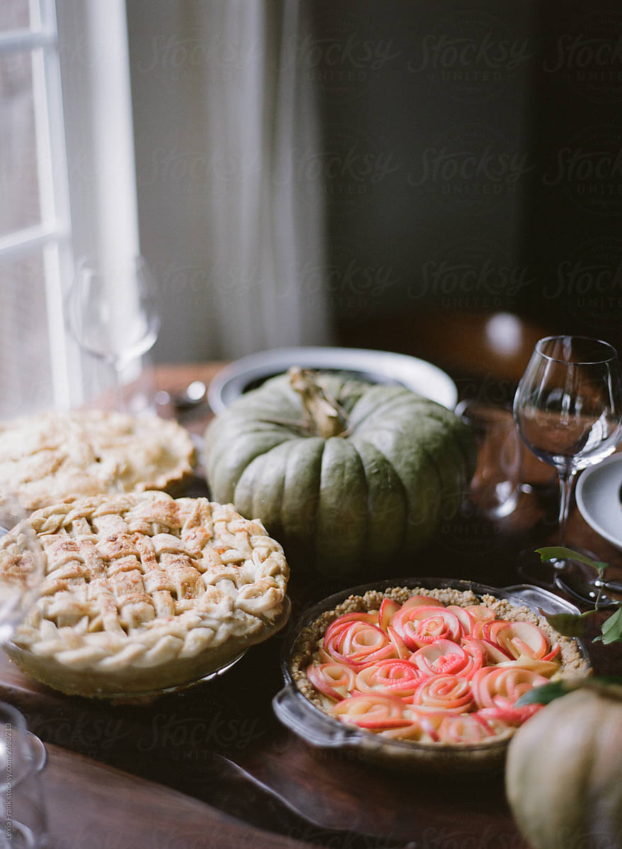 non-alcoholic thanksgiving table with pies and dark styling