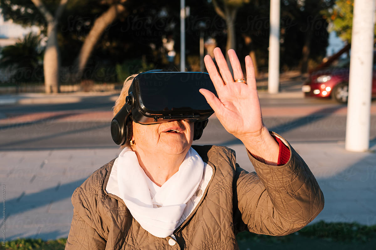 Cheerful older woman with vr glasses