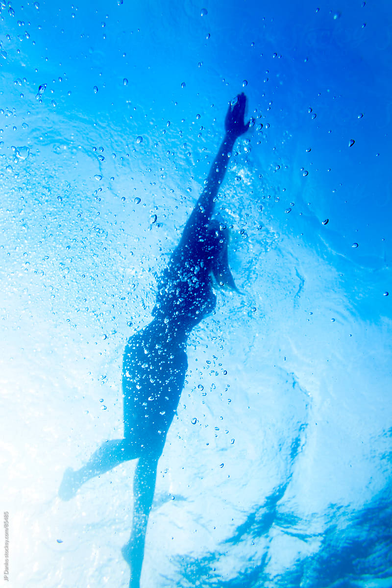 Sexy Woman in Bikini Silhouette Swimming Underwater