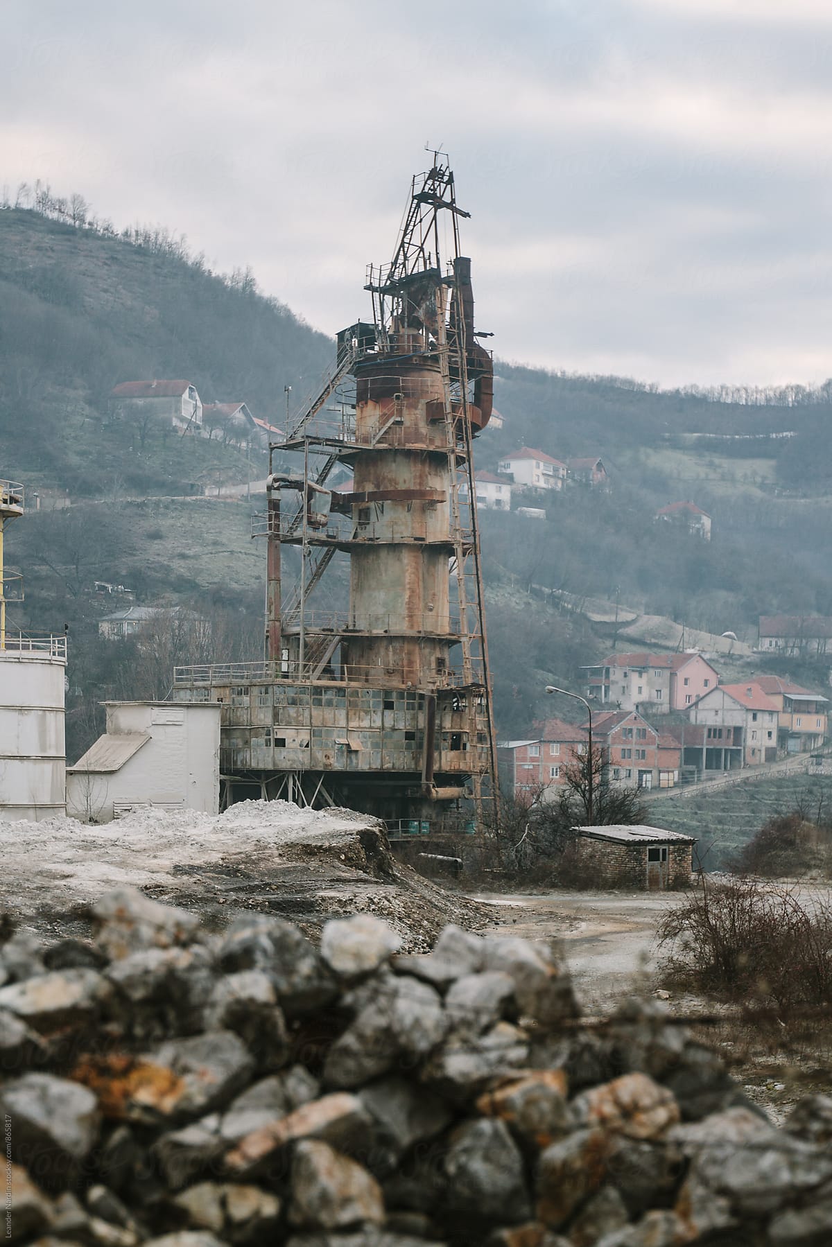 abandoned factory site with big steel tower in former war zone, kosovo