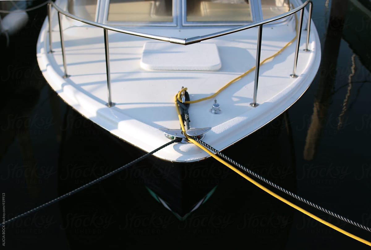 The Bow Of A Clean Boat Tied In The Harbor