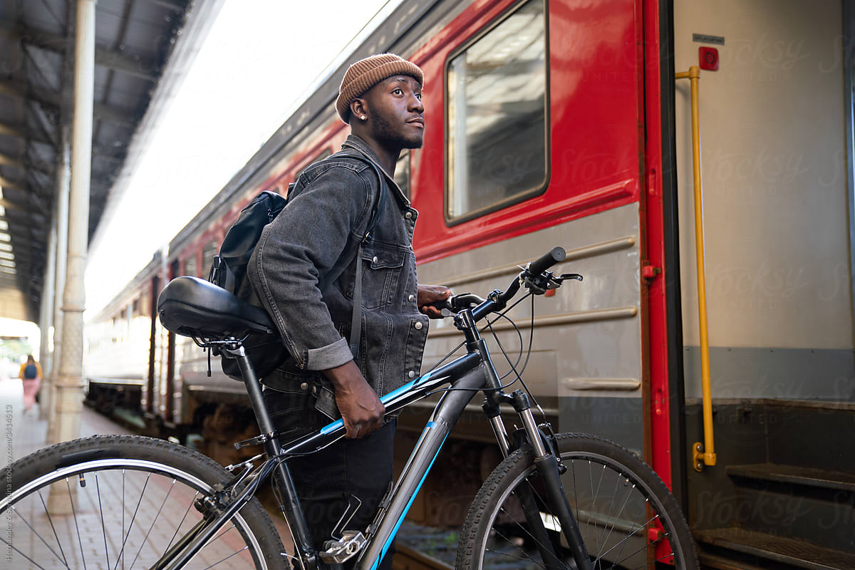Man With Bicycle Entering To Train