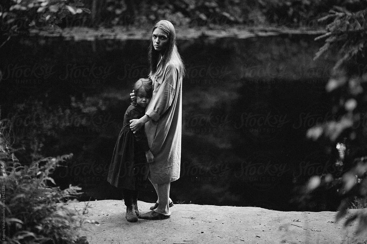 Little girl and mother at the river