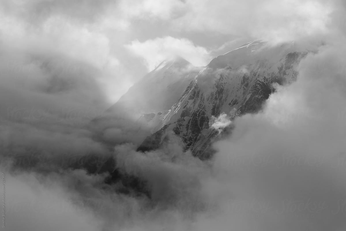 Himalayan mountains through the clouds.