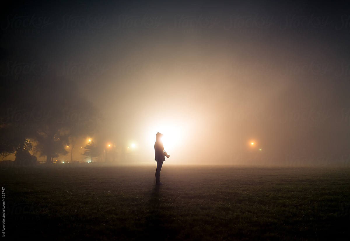 Photographer silhouette in the fog