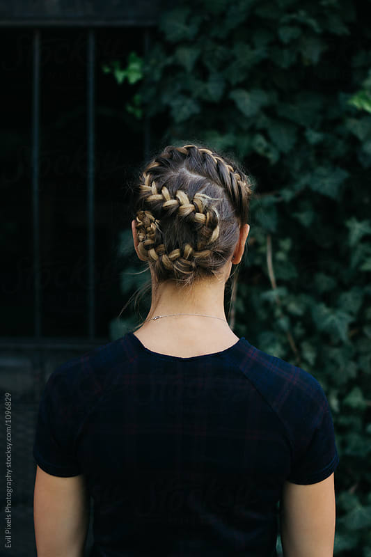 Anonymous female model from back with interesting hairstyle