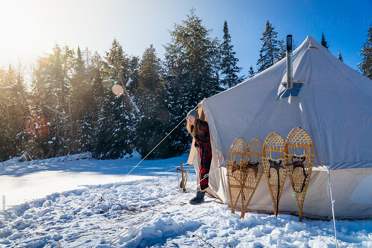 Stepping out of Tent with Winter Landscape and Snowshoes
