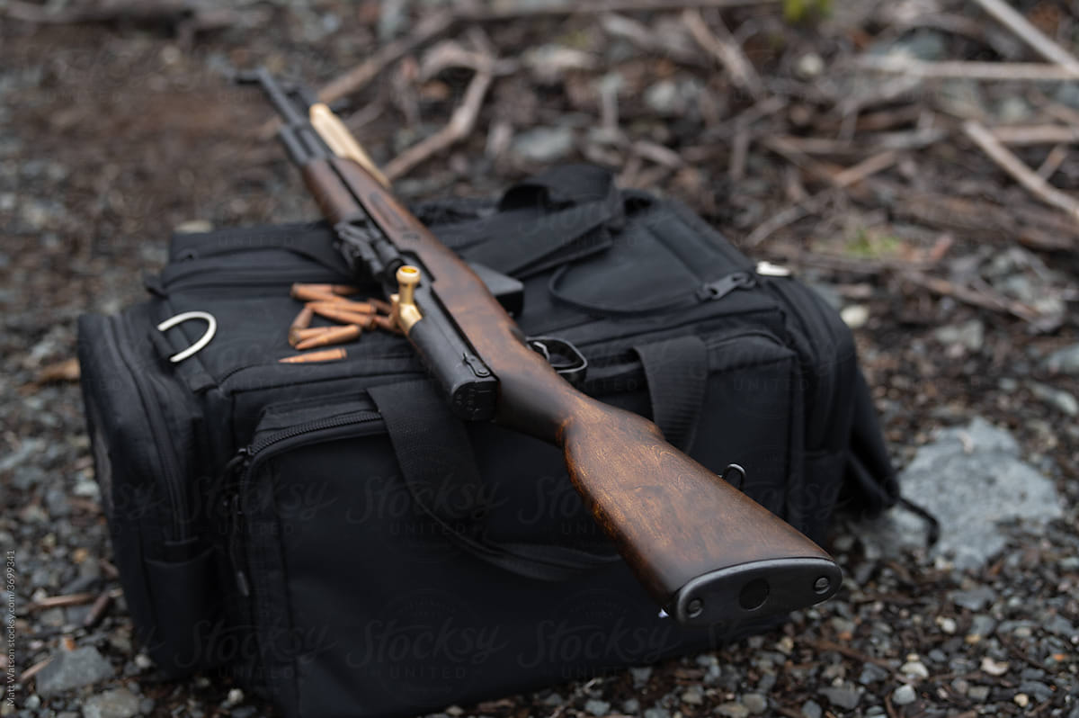 SKS Rifle on shooter\'s bag – wide depth of field alt angle