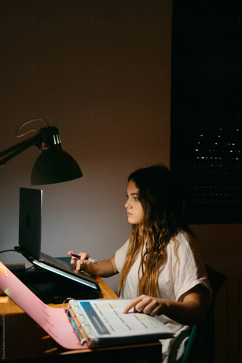 Teen student studying at night