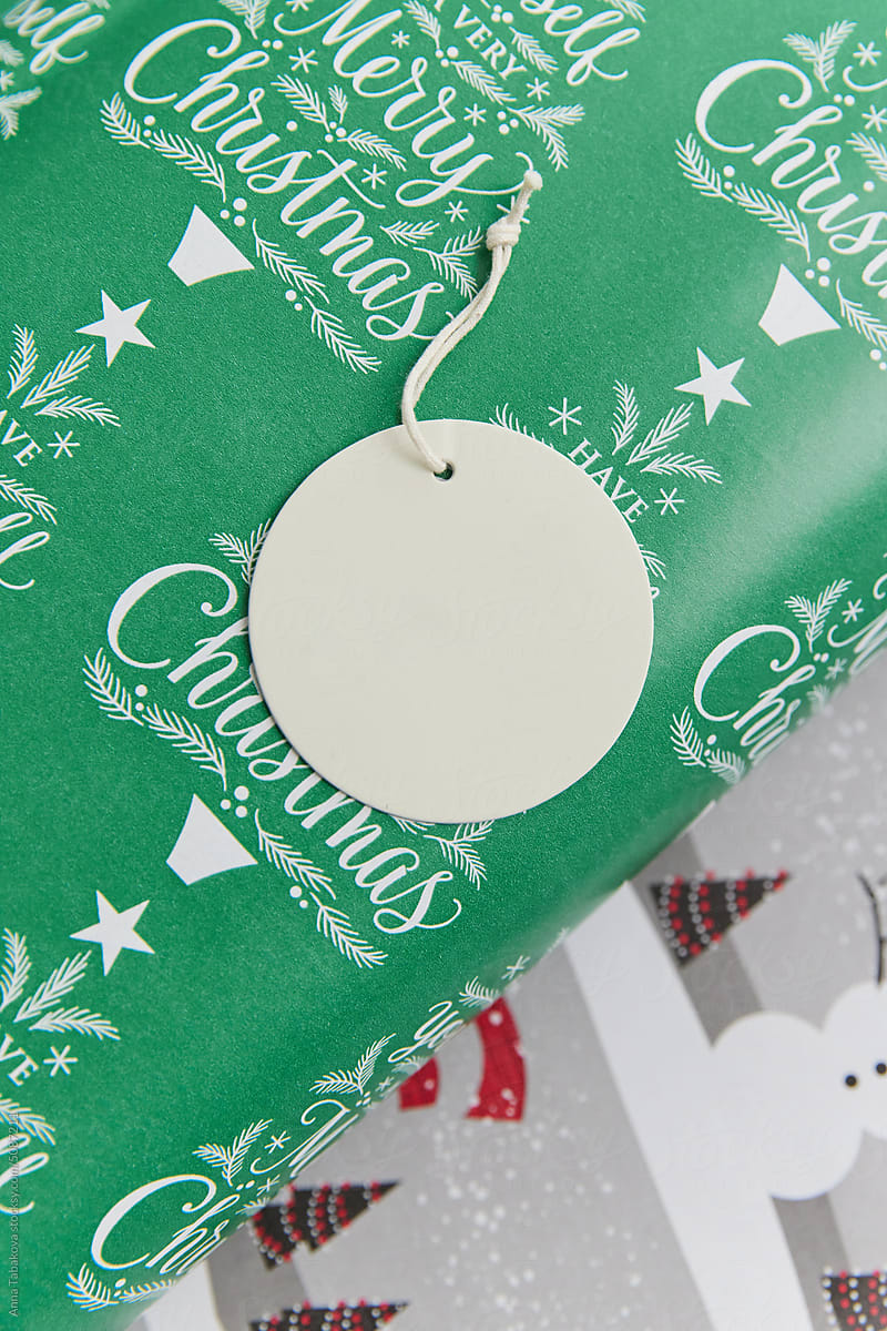 Round blank label on Christmas paper