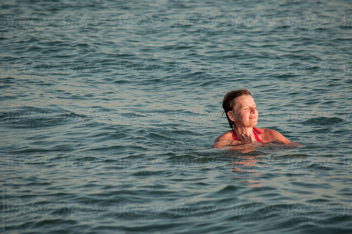 The woman floating in the sea