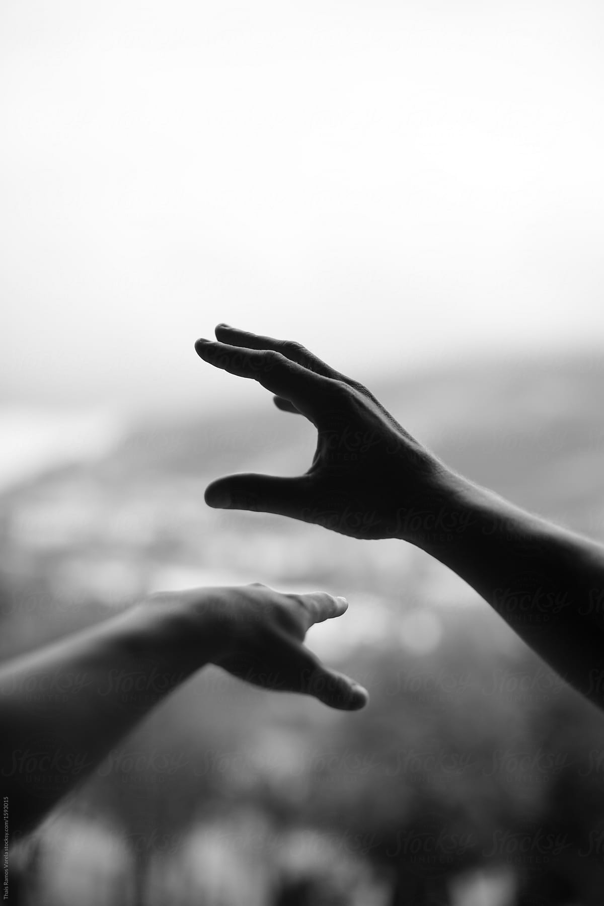 movement of two hands in black and white