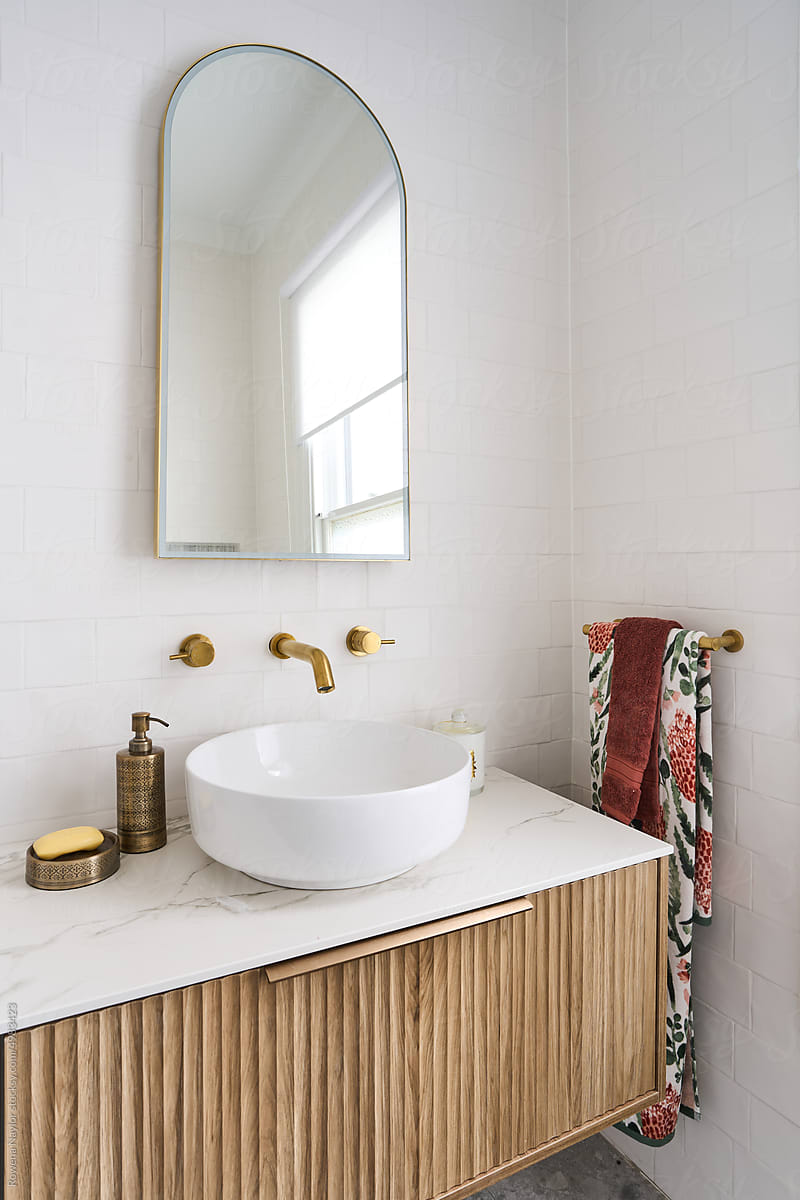 Stylish bathroom with brass tap ware